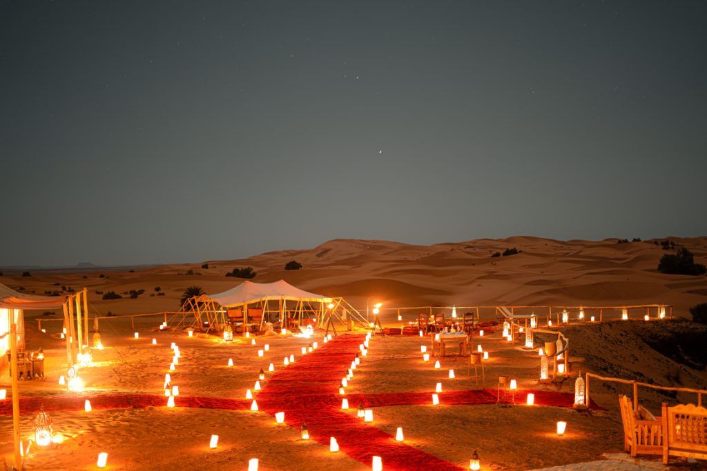 Candles illuminating the Luxury Desert Camp in the Sahara Desert.