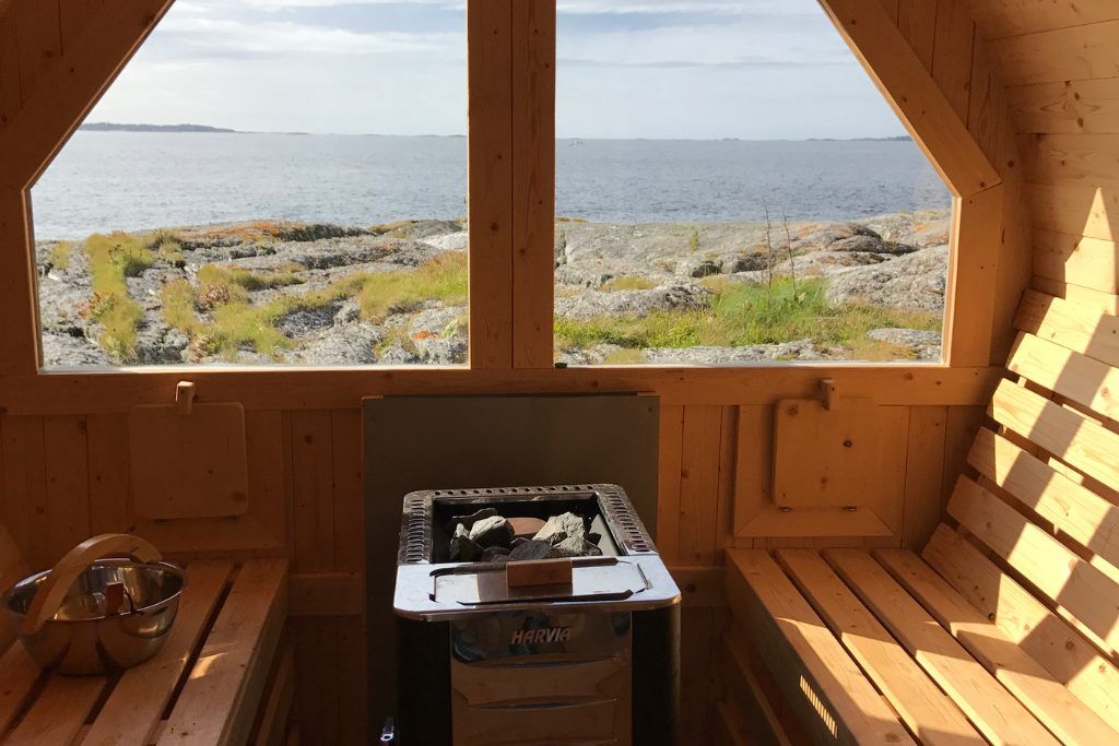 A view of the rocky island from the sauna of a private lighthouse on Norway.