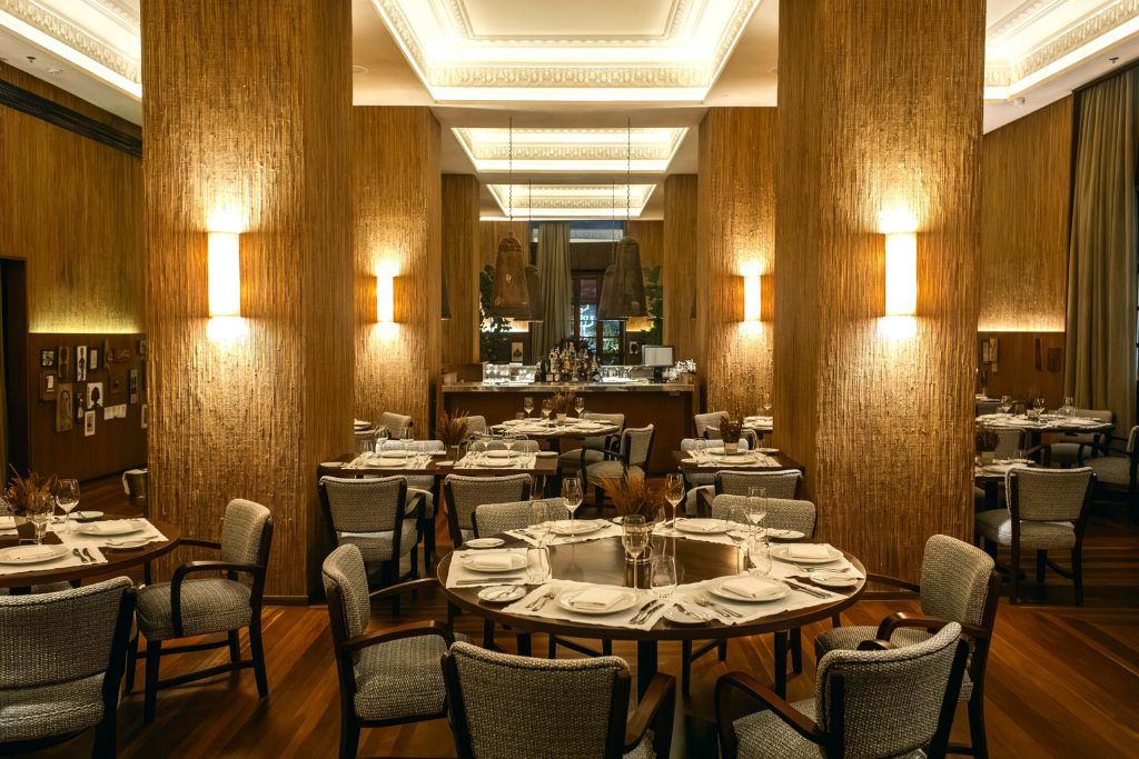 The restaurant at the Hotel Fasano Salvador with dim lighting.