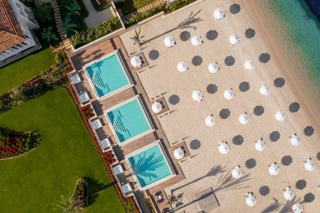 An aerial view of the swimming pools and beach at the One&Only Portonovi.