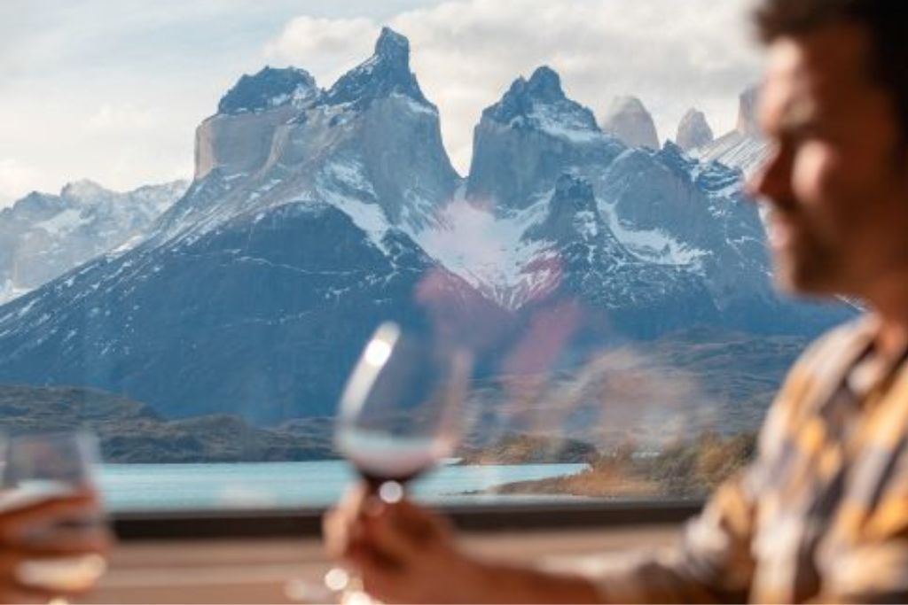 Man drinking wine in luxury lodge in Patagonia