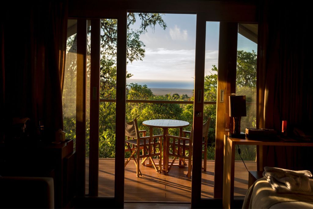 Sun shining down on balcony of luxury suite at the Galapagos Safari Camp