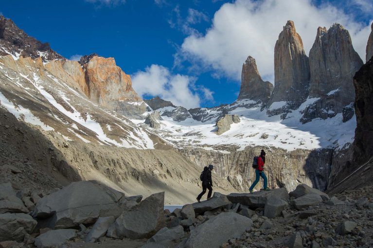 Travelers hiking the three towers trail in Patagonia during luxury tour