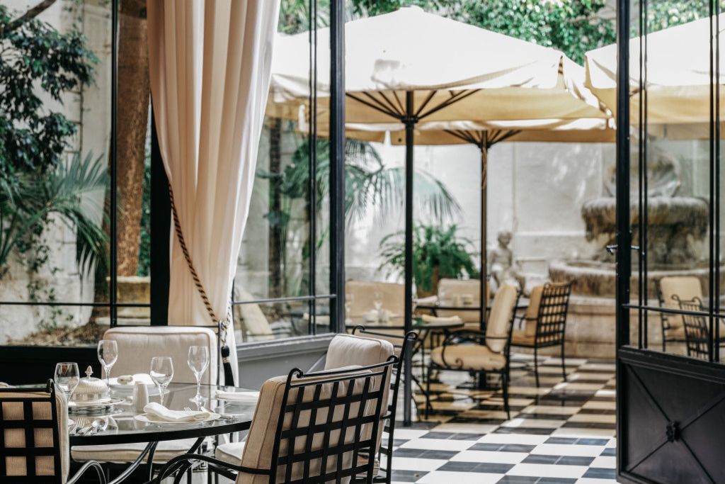 Beautiful garden dining area in Barcelona's luxurious Hotel El Palace