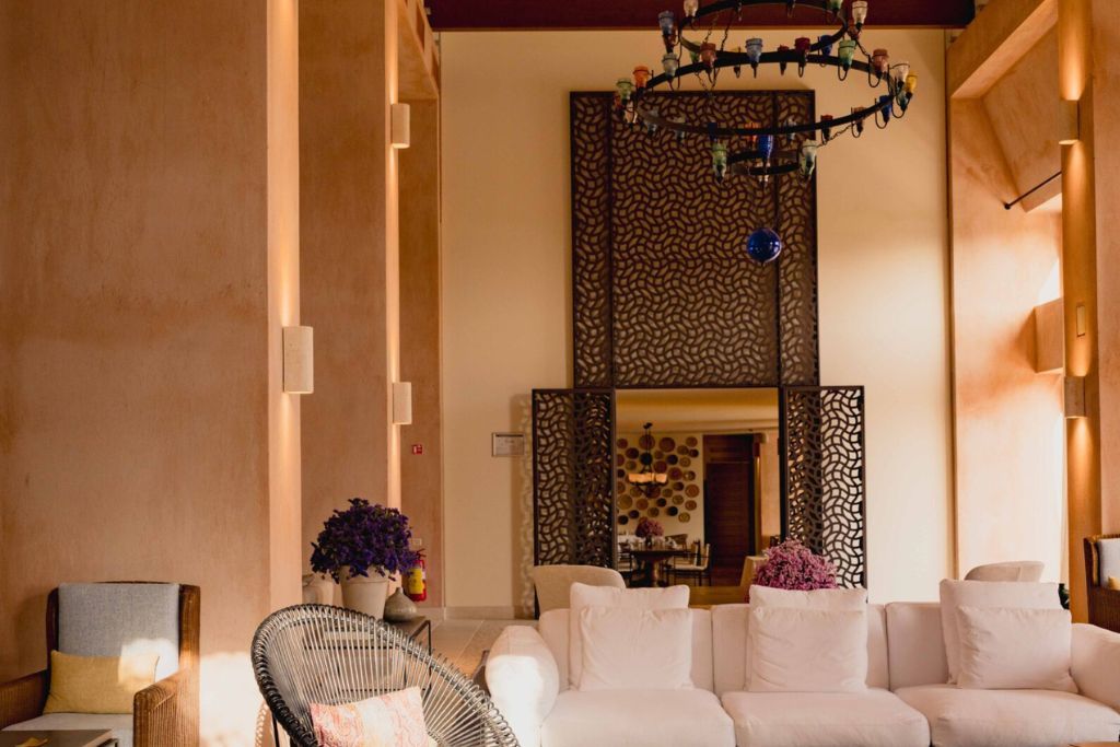 A view of the room with a chandelier in the Phaea Blue Palace