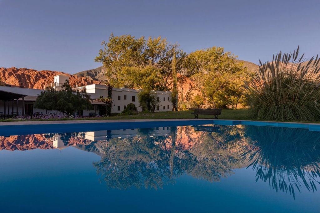 The luxurious Manantial del Silencio reflecting in the outdoor swimming pool