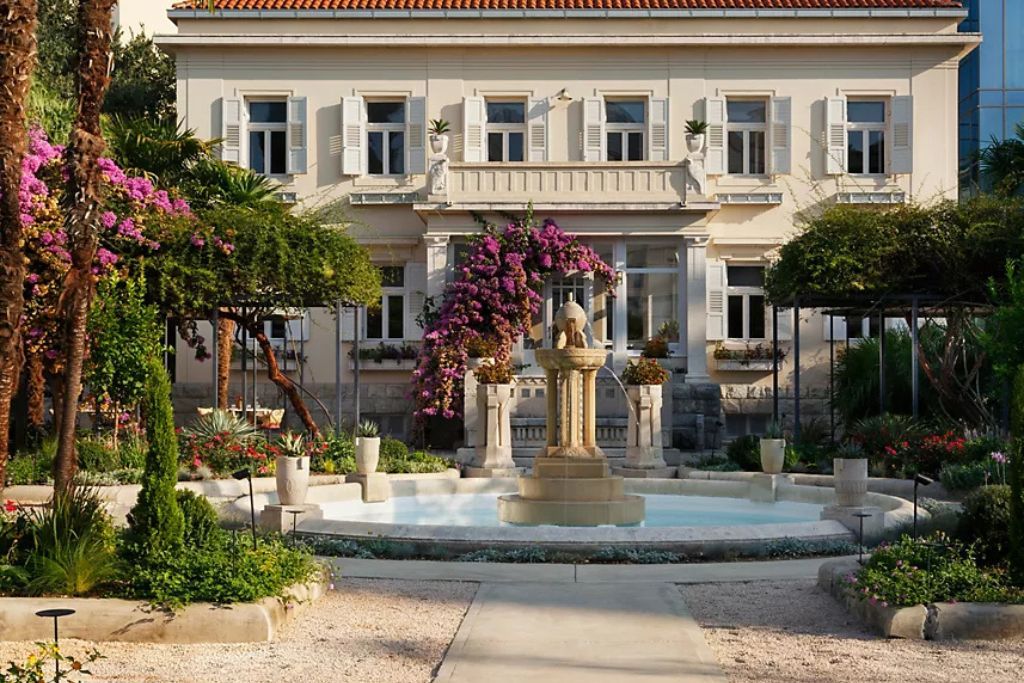 Fountain and gardens in front of luxury hotel in Croatia