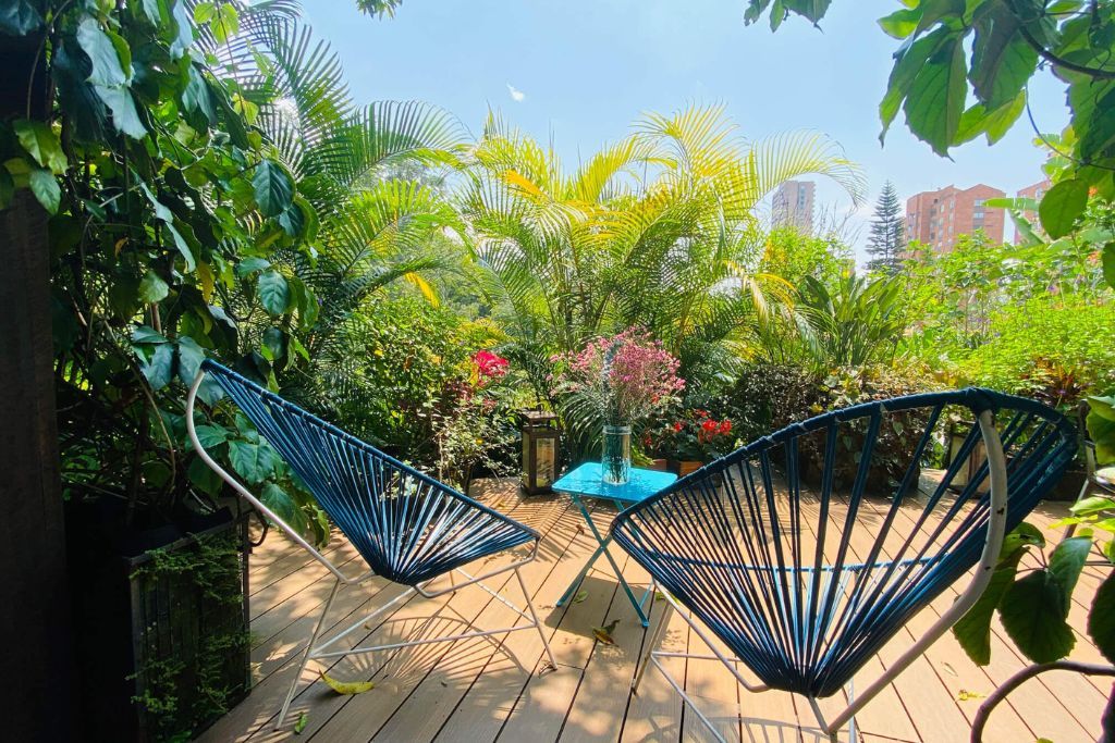 Lush green landscapes surrounding outdoor balcony at the Patio del Mundo in Colombia