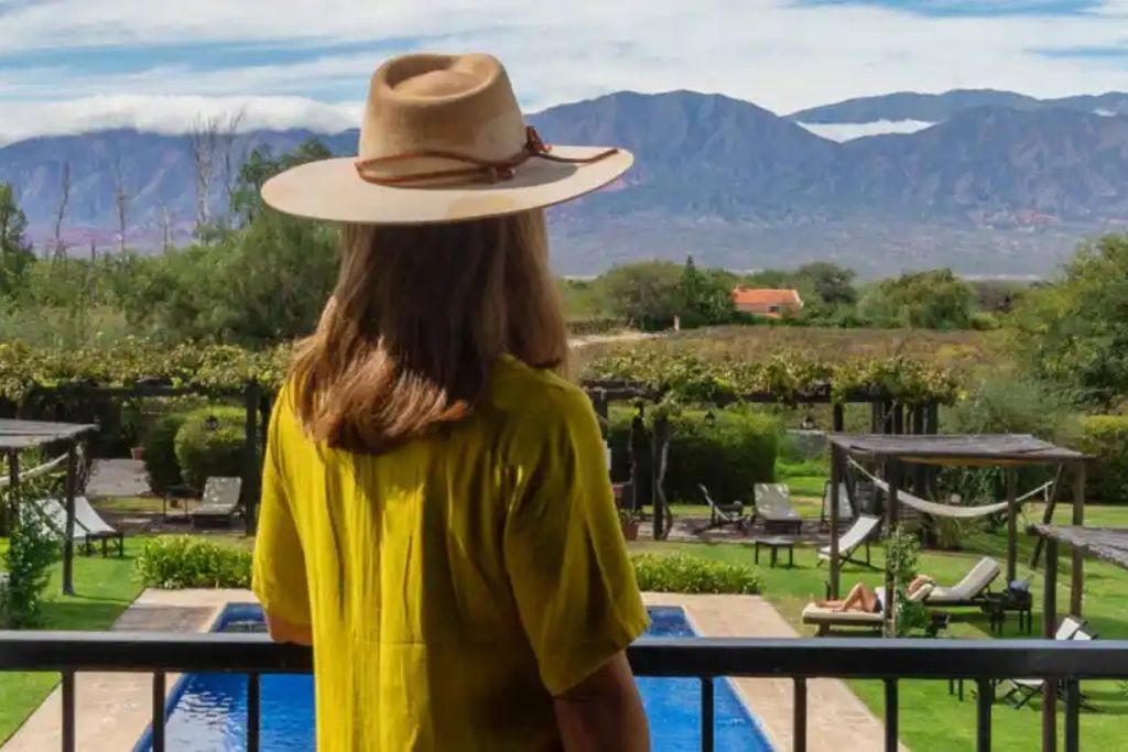 Woman admiring view of mountains from the luxury Patios de Cafayate hotel in Argentina