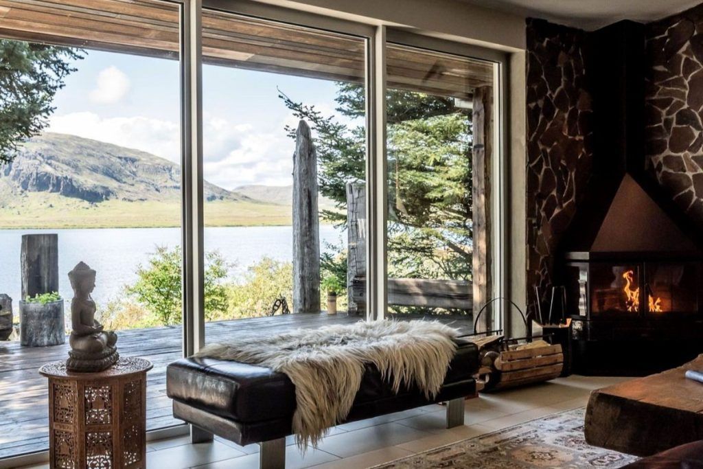 A view looking out over the water from the window of a bedroom in a private villa in Southern Iceland.