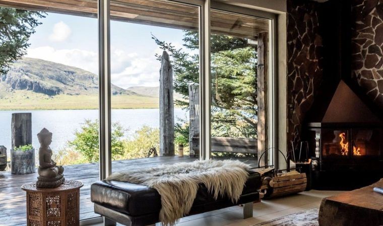 A view looking out over the water from the window of a bedroom in a private villa in Southern Iceland.