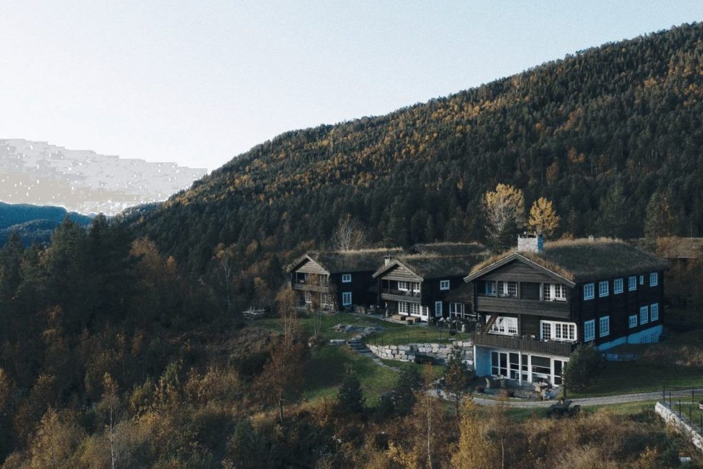 The exterior of Storfjord Hotel situated in the hills.