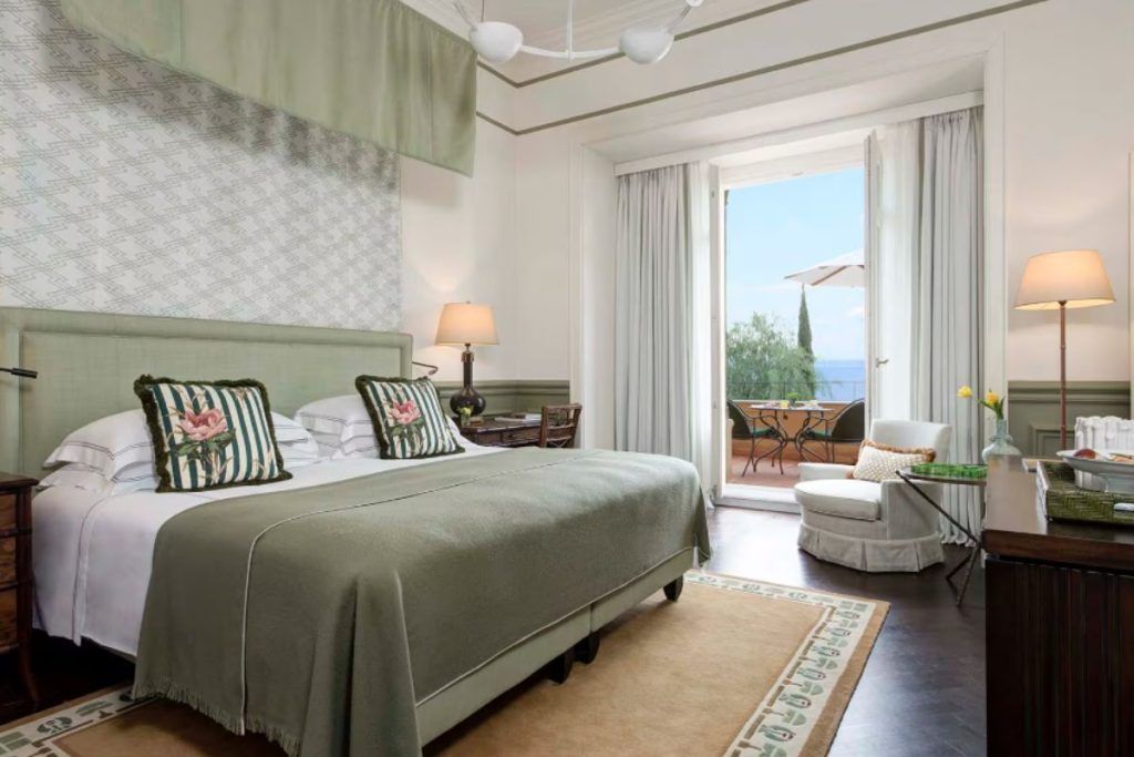 A sunny room with green accents at at Villa Igiea.