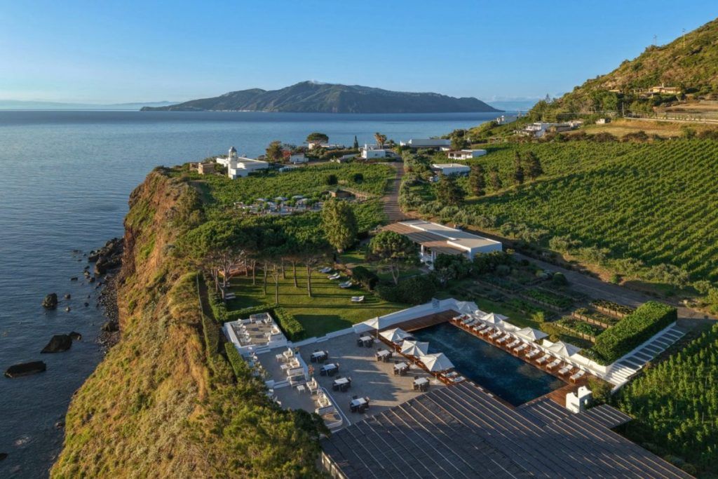 An aerial view of the Capofaro Resort along the oceanfront.