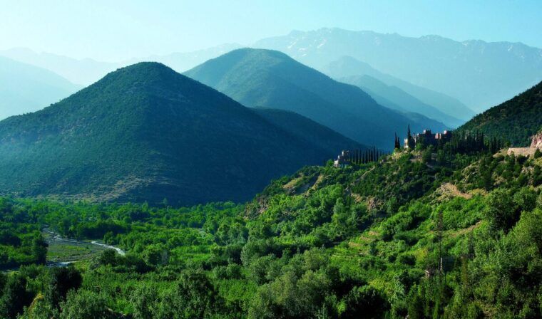 The Atlas Mountains with greenery growing on the slopes.