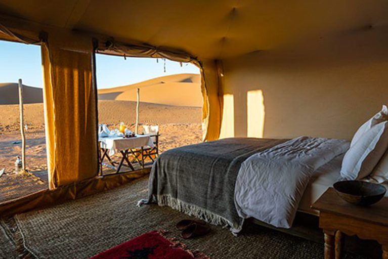 An interior view of one of the tents in the Luxury Desert Camp in Morocco.