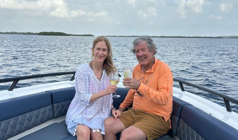 Couple enjoy champagne sunset drinks as they boat in Panama