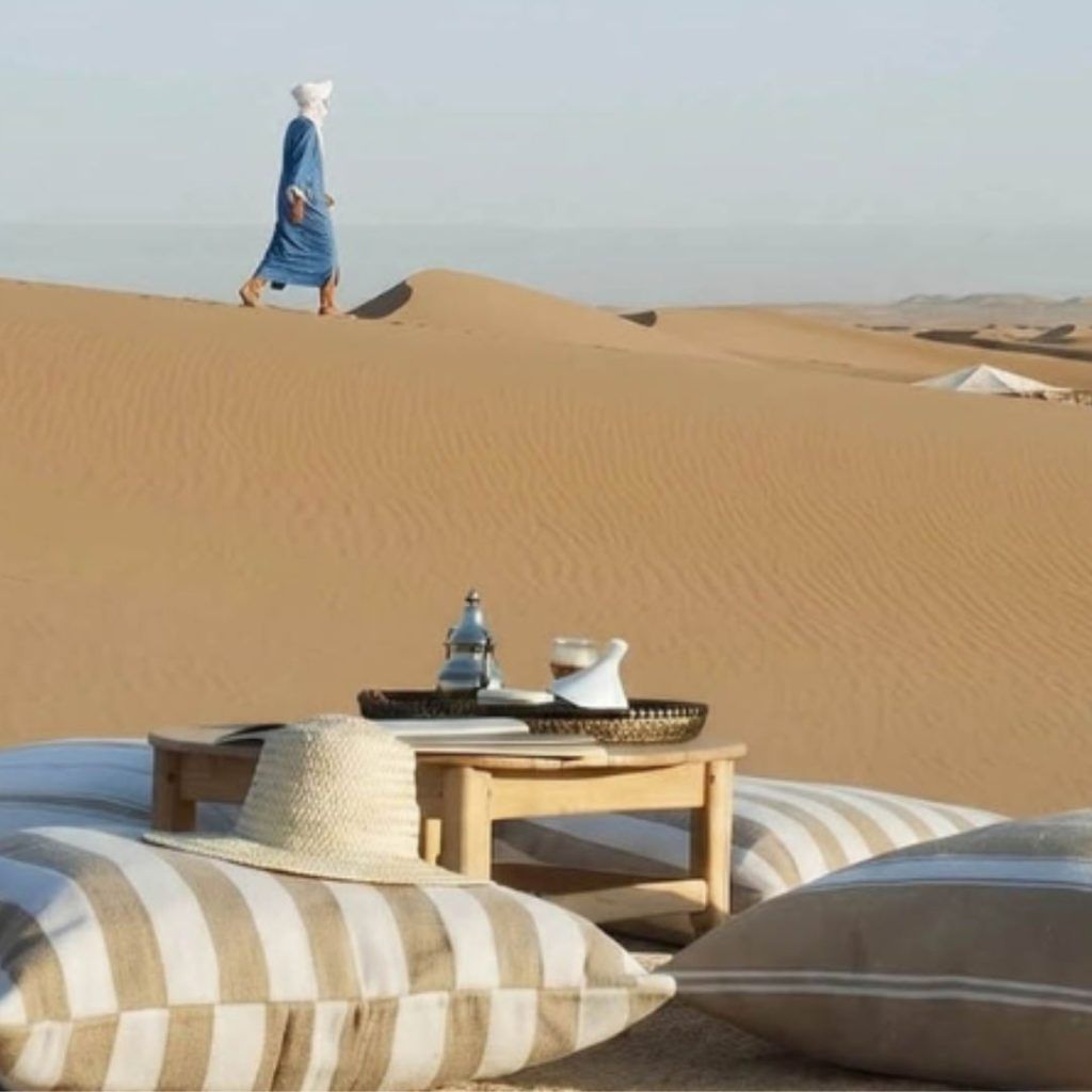 Private picnic set up at luxury deset camp in the remote Sahara Desert