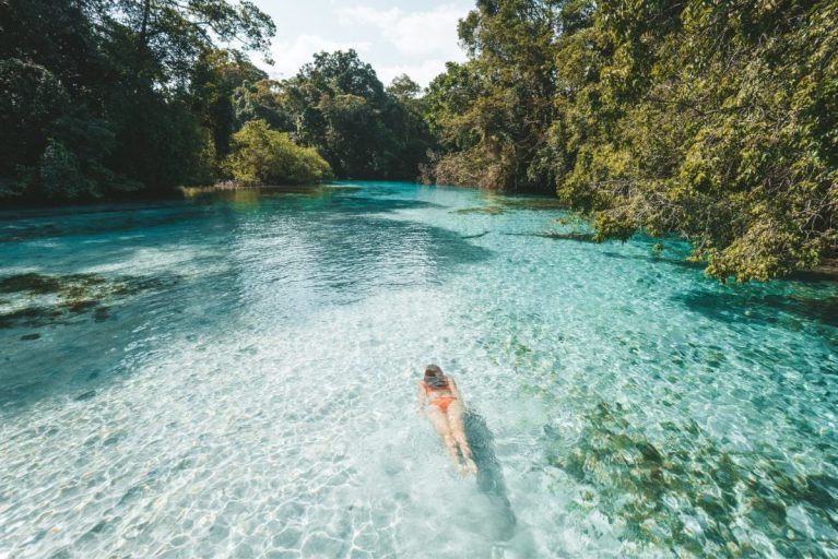 A woman snorkeling in clear water in Panama.