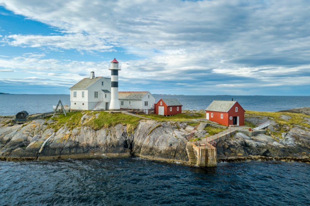 Aerial view of refurbished lighthouse on a private island in Norway