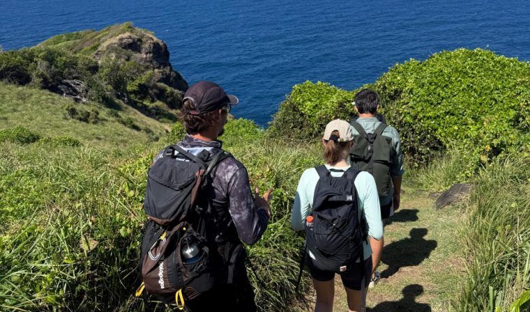 Blue Parallel team members hiking along the coast at Fernando de Noronha.