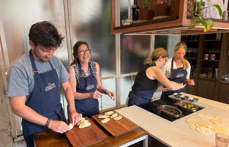 Group of luxury travel advisors enjoying a private cooking class during luxury tour with Blue Parallel