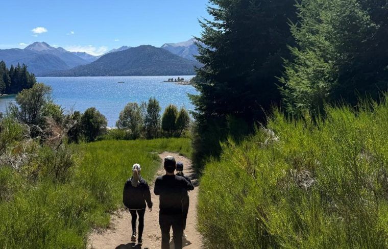 Group of travelers hiking on Llao Llalo in Patagonia's Lake District during luxury tour