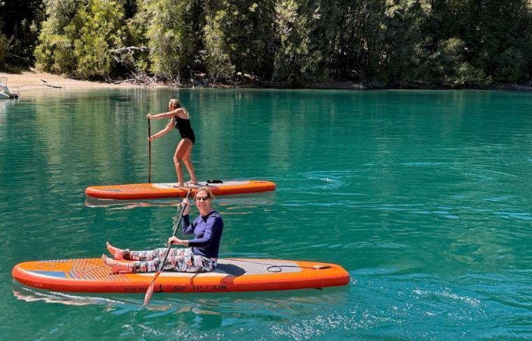 Travelings paddle boarding on Llao Llao in Bariloche